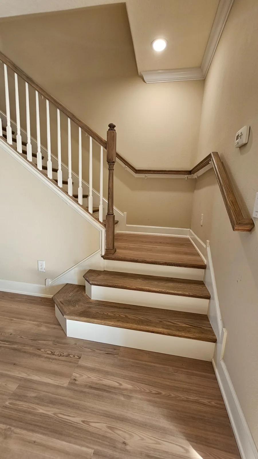 Restored staircase with wood-look treads and white risers